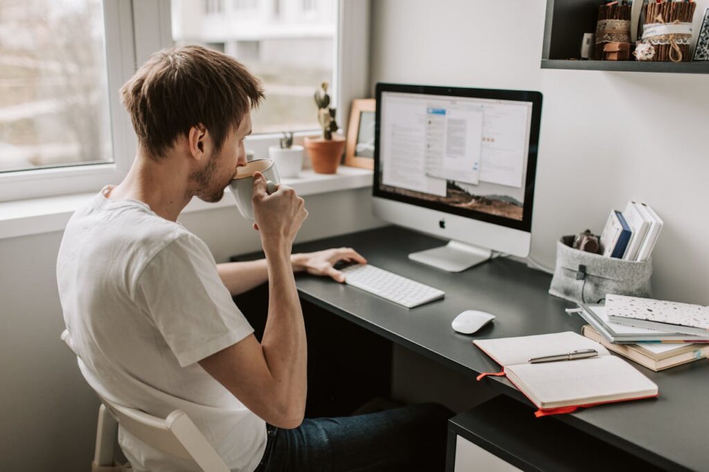 Photo Of Man Drinking On Mug